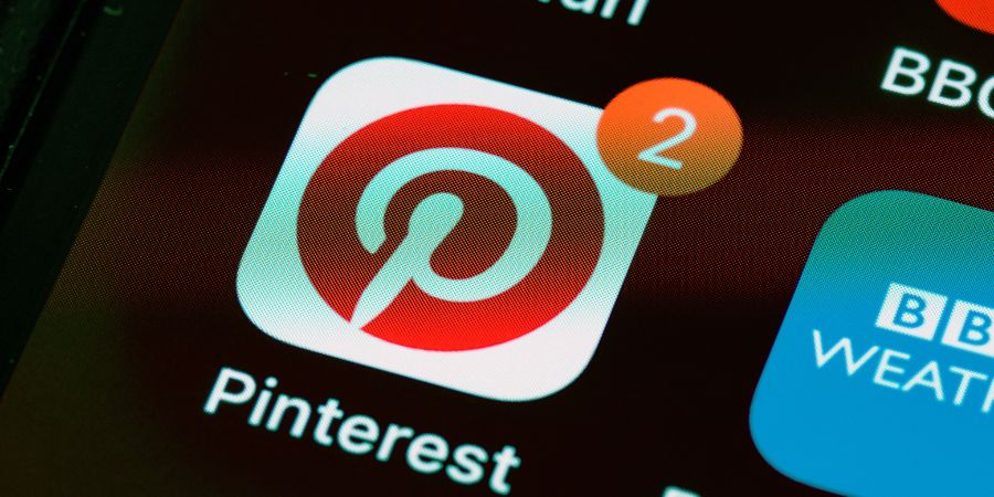 Pinterest logo with 2 notification on the screen for social media Management